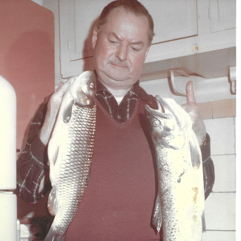 Robert Goulley showing off a catch of fish